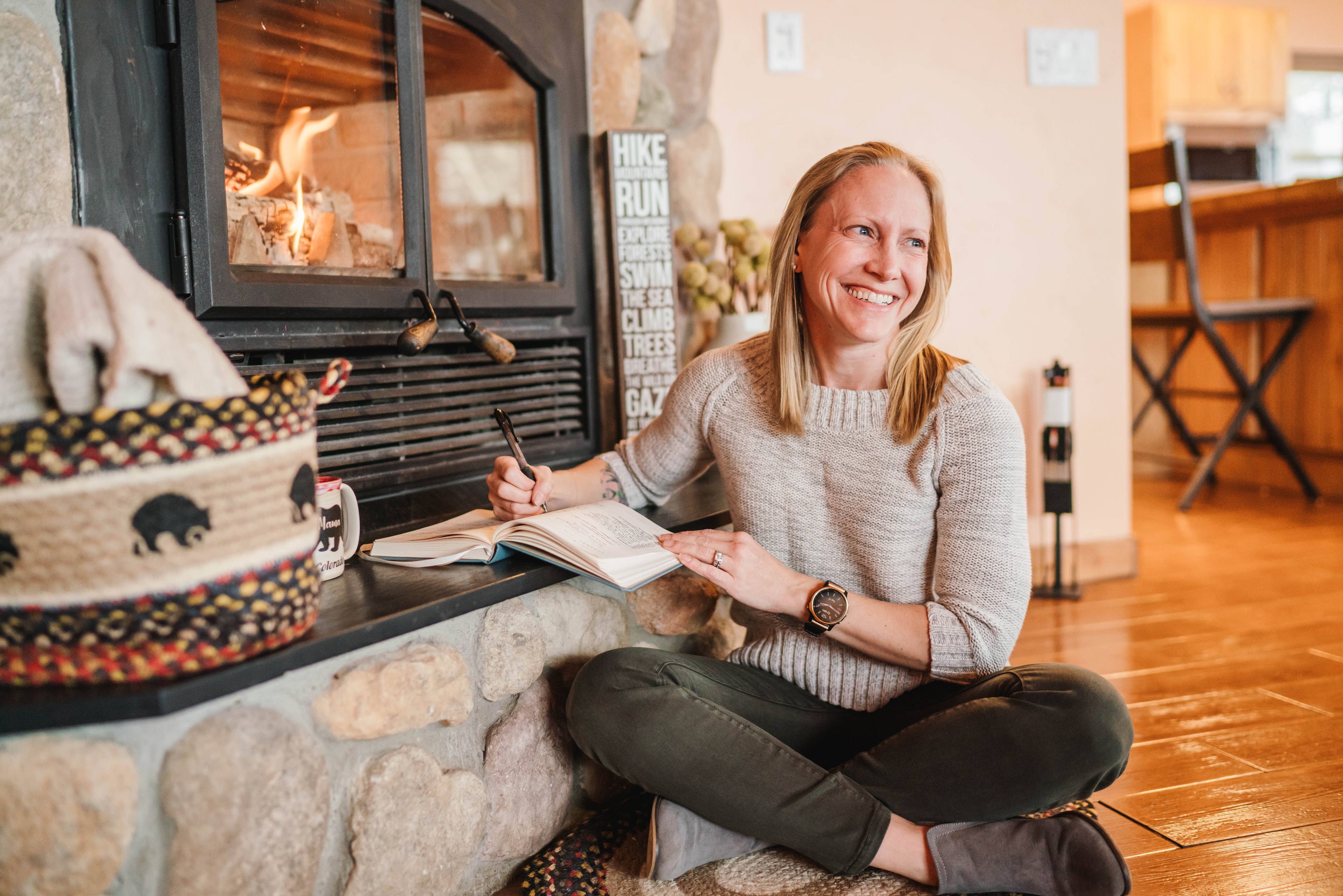 Joleen Bingham writing by the fireplace